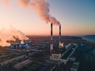 Industrial factory pollution, smokestack exhaust gases. Industry zone, thick smoke. Climate change and global warming