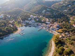 Agios Stefanos bay, one of the most beautiful fishing villages in Corfu Island. Kerkyra, Greece. Aerial drone  view.