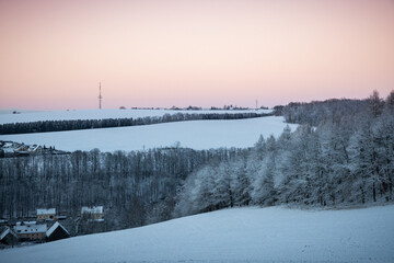 Winter above ice cold city of Chemnitz, Germany. Frozen hoar frost trees and forests covered in...