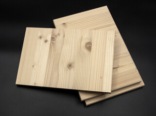 White pine planks, cut to identical dimensions in the shape of a rectangle. They can be used for various purposes in the construction industry.