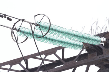 Hanging glass insulators for power lines close-up