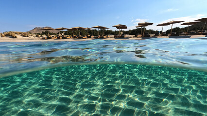 Obraz premium Underwater split photo of paradise beach of Simos in island of Elafonisos, Lakonia, Greece