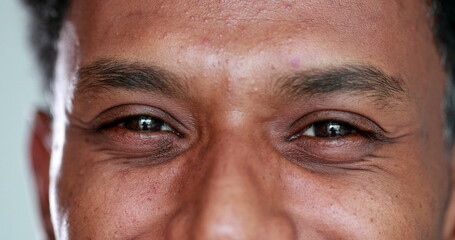 Mixed race african man eyes closeup smiling macro eyelid