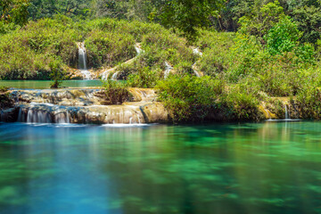 Obraz premium Semuc Champey cascades along the Cahabon river with long exposure, Peten rainforest, Lanquin, Guatemala.