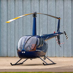 Robinson R22Two seat single engine helicopter on the ground. © Robert Parker