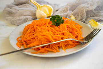 korean carrots on wooden background
