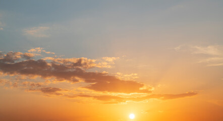 Fototapeta na wymiar Fantastic bright clouds in the sunset sky. Sky background.