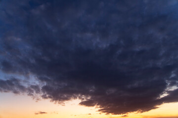 Fototapeta na wymiar Dramatic bright clouds after sunset sky. Sky background.