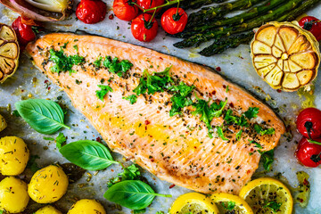 One sheet pan roast trout fillet with potatoes, asparagus and vegetables - obrazy, fototapety, plakaty