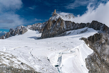 The Geant glacier in the massif of Mont Blanc; in the background the peak of the Dent du Géant (Alps, between France and Italy)