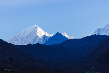 Snowy mountain peaks at dawn in the Himalayas Manaslu region