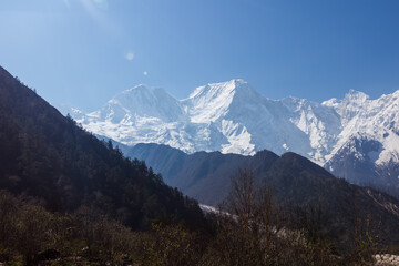Fototapeta na wymiar Snowy mountain peaks in the Himalayas Manaslu region