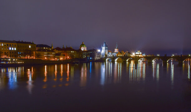 City landscape at night, bridge over the river