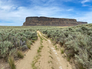 Dusty road leading towards Steamboat Rock in Eastern Washington