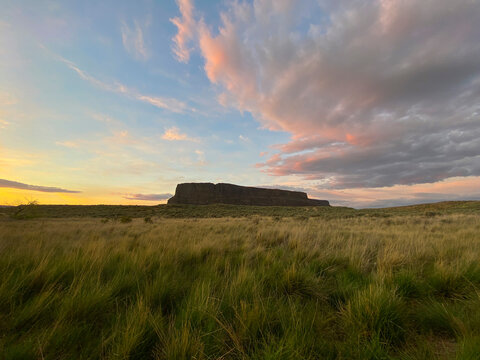 Steamboat Rock at sunset with pink clouds