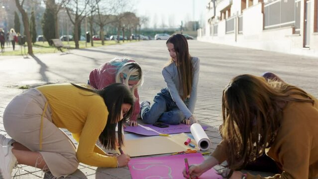 Multicultural group preparing together feminist movement womens international day 8m slow motion 