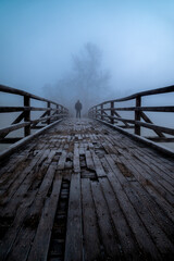 Naklejka premium wooden bridge over the river