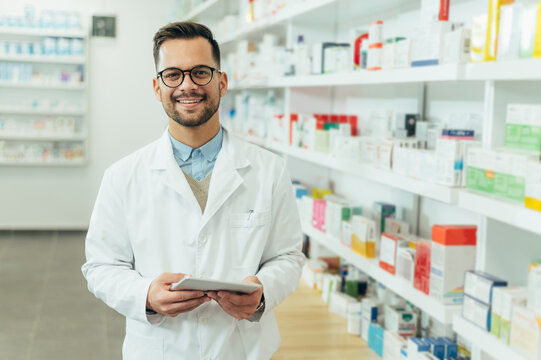 Portrait of a handsome pharmacist working in a pharmacy