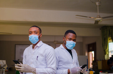 doctors in the lab using their cellphone