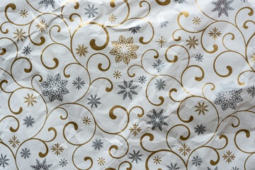abstract background with snowflakes and curvy lines in gold and silver