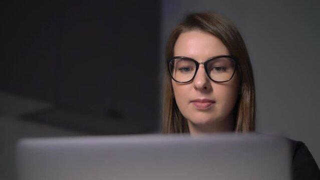 Person using the laptop. Woman working on computer.