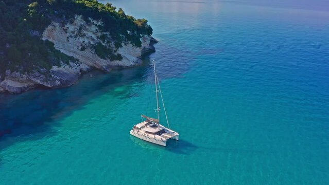 Azure blue water lagoon and luxury yacht catamaran in Greece island Zakynthos
