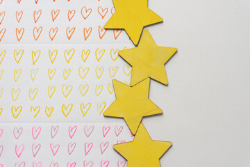 colorful hearts and yellow wooden stars with blank space