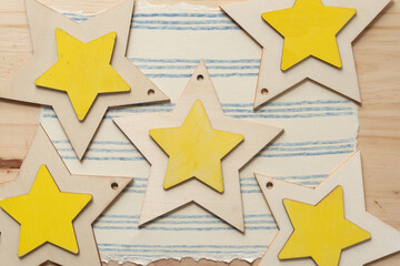 wooden stars on paper with line patterns (on wood)