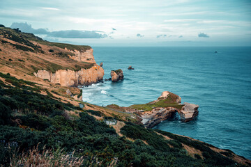 Coastal views with rock formations in the blue ocean