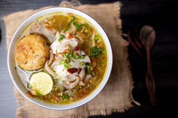 Soto Ayam is a traditional Indonesian soup mainly composed of broth, chicken and vegetables