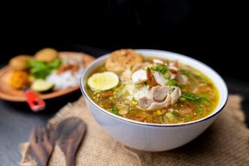 Soto Ayam is a traditional Indonesian soup mainly composed of broth, chicken and vegetables