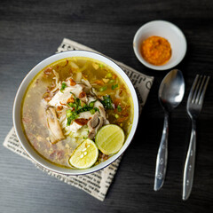 Soto Ayam is a traditional Indonesian soup mainly composed of broth, chicken and vegetables