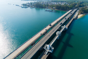 Fototapeta na wymiar Aerial top view drone shot of bridge with cars on bridge road image transportation background concept