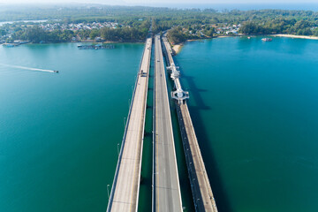 Fototapeta na wymiar Aerial top view drone shot of bridge with cars on bridge road image transportation background concept