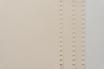 paper with spiral (or holes where a metal spiral once existed)