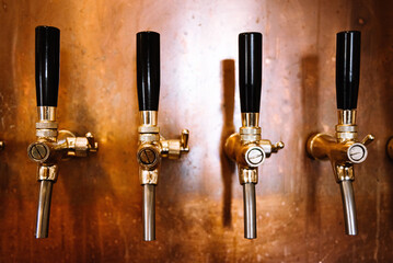 beer tap many in a row bar interior copper wall