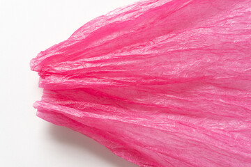 hot pink crepe or tissue paper on a white background