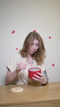 a girl opens a gift and finds a gingerbread heart in it