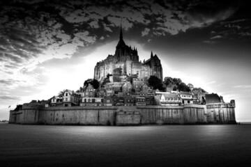 Ancient castle on the hill on an island Mont Saint Michel, black and white 