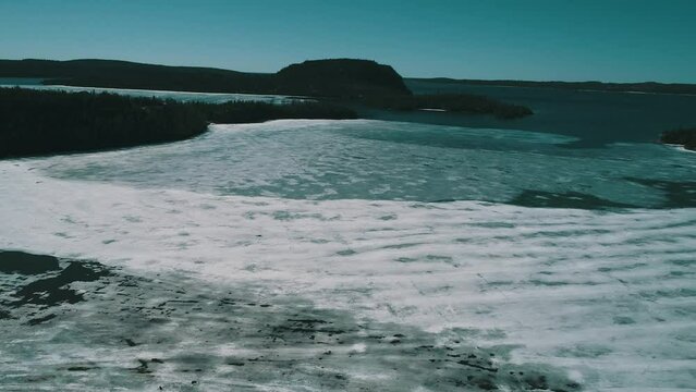 Ice has formed in the bay along the coastline of the Pacific ocean. 