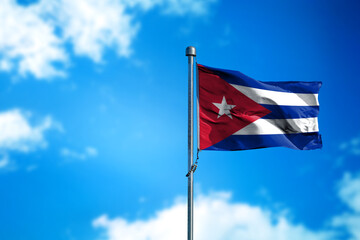 Flag of Cuba on the wind against blue sky