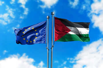 Flags of European Union and Palestine on the wind against blue sky