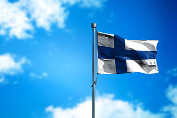 Flag of Finland on the wind against blue sky