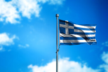 Flag of Greece on the wind against blue sky