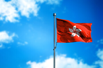 Flag of Hong Kong on the wind against blue sky