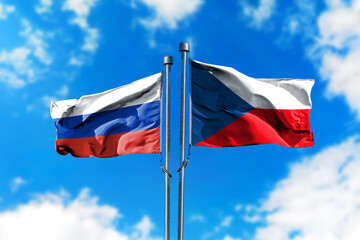 Fototapeta na wymiar Flags of Russia and Czech Republic on the wind against blue sky