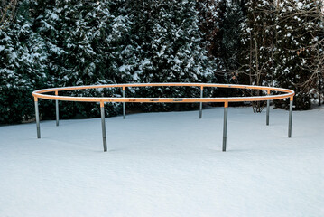 trampoline wheel in the snow  - trampoline construction in a snowy garden - size 12 feet