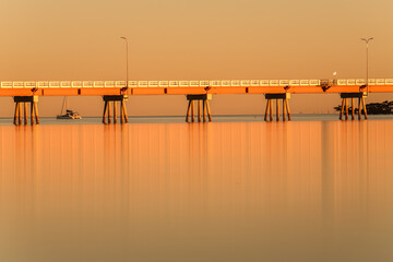 A section of the famous bridge on Bribie Island in Australia with beautiful water and reflections