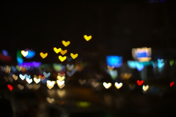 bokeh and blur abstract heart shape love valentine colorful night light at on street