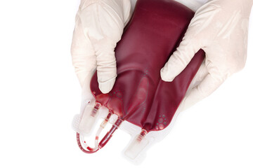 A doctor in latex gloves holding a blood bag.  Blood transfusion and blood donation concept. - obrazy, fototapety, plakaty